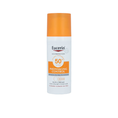 Eucerin sun cream bottle with orange cap on a white background